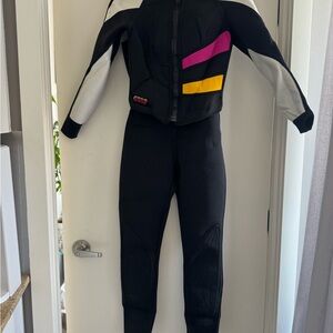Black wetsuit with Pink and Yellow Accents